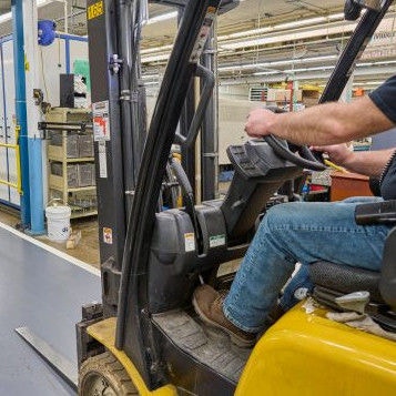 Two employees wearing surgical masks.